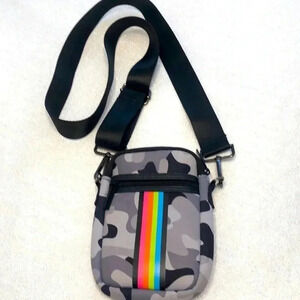 Haute Shore crossbody bag.  Grey/black camo design with rainbow stripe on front.